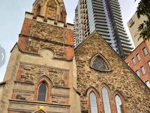 I hate seeing old architecture dwarfed by highrise