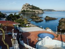 The Cartoromana belvedere overlooks the sprawling 'Termale Eden' spa. That popular thermal spa was in the process of preparing for opening in the next few weeks. Those islets trace the edges of Ischia's own submerged ruin, the 'Villa Romana'. Snorkelers love to explore those ruins. As we traipsed across that SE corner of the isle, we joined another hiker. She was lovely young Veronique, a Belgian archaeologist who worked in Holland. She was also very knowledgeable about Euro-travel in general.