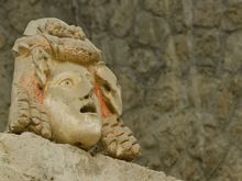 Roman theatre mask decor replica. Some of the best relics are in the Naples Archaeology Museum, an absolute must-visit. It seems that 18C Bourbon diggers made off with a lot of items. 