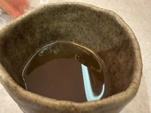 Incredibly delicious consommé presented in a handmade ceramic bowl as a complimentary first course.   A harbinger of delicious things to come!  I think the base was poultry.