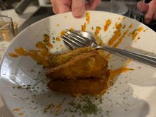 Fiore di zucchini, stuffed with the traditional ricotta and anchovy, and smoked Datterino tomatoes, then lightly fried.  Notice the mention of the type or login of the tomatoes served in many Sicilian restaurants.   My dinner companion has already ordered seeds to plant in her garden outside Oakland!