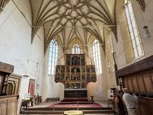 Classic late Gothic hall church with intricate stone-ribbed vaulting