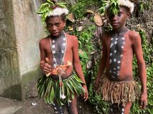 Boys in local dress at the barge bunkers