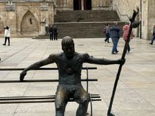 The city is statue filled; a pilgrim at rest