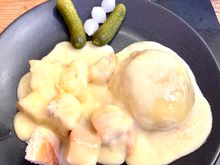 Cheese over mashed potatoes and bread cubes 