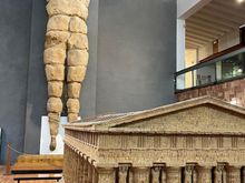 Another of the 38 telamons from the Temple of Zeus--the model in the foreground shows the positioning of them