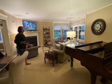 Living room. The wall behind the piano is all built-in bookshelves. 
