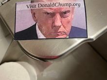 This was in a stall in the ladies bathroom. Scary!! Haha. I’m not promoting any website, I haven’t even looked at that. It was the picture watching me and the thought that someone left it there. 