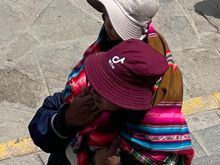 Very interesting way of carrying child by the mom