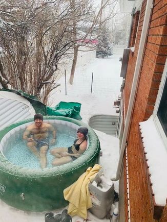 A pandemic hot tub photo from today. My husband and daughter enjoying the -1 temps.  