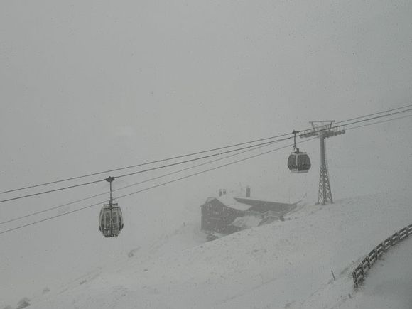 There’s a long, 4-kilometer gondola ride (12 minutes) to the top of the Kronplatz—elevation 2,275 meters (about 7,500 feet). The man selling tickets at the lower station casually said, “You know it’s snowing at the top of the mountain, right?” That became evident about halfway up.