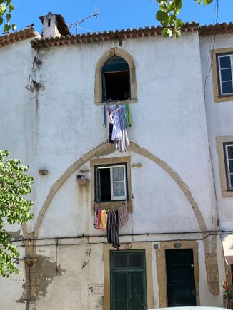 The old and the new - medieval arch absorbed into a building 