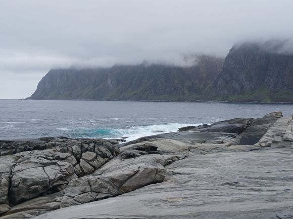  Views of the Norwegian Sea and the razor-sharp Okshornan mountain peak (called the Devils Teeth), partially obscured by clouds