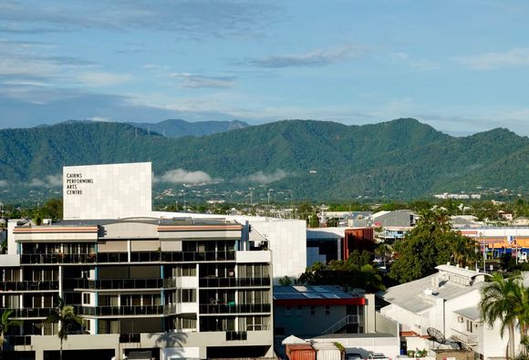 Cairns surrounded by green mountains 