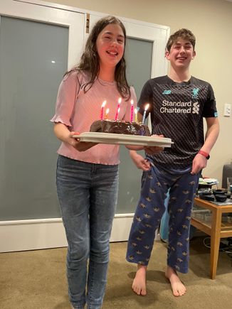 Molly made me a belated birthday cake, Harry iced it.