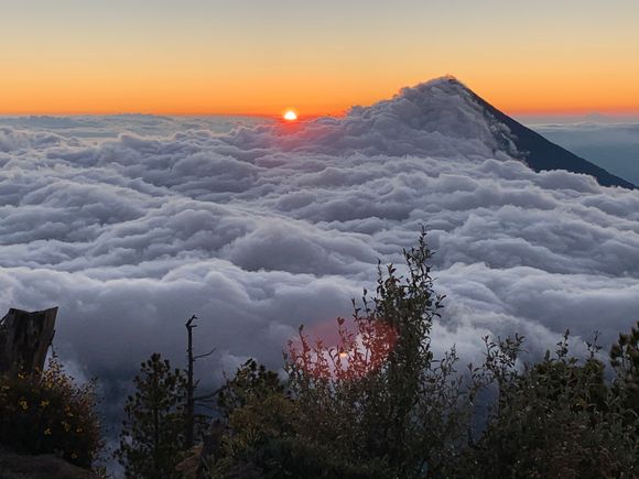 I love this phot.  Above the clouds blanketing Volcano Agua at sunrise from base camp on Volcano Acatenango.