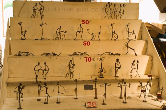 Some metal craft and other artifacts are sold in the covered semi-open village market, along with cheese and fruits.
