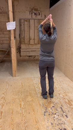 My SIL about to successfully complete her ax throw