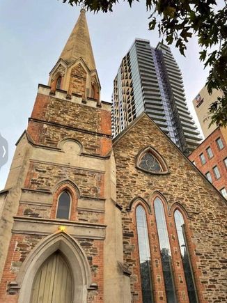 I hate seeing old architecture dwarfed by highrise