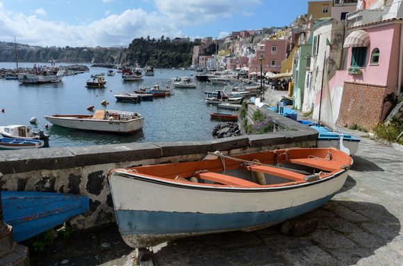 With the whimsical houses behind it, this boat was stored outside. But the local architecture also boasts some clever arched boat-storage shelter and corners.