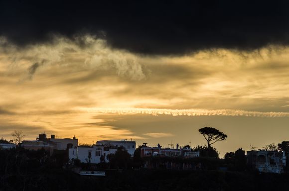 And were glad that we did. The ferry cruised along the Scola Frusta coastal section of Procida's 'Vivara' wilderness reserve. Moody clouds signaled a special sunset to come. It was one of those added-value moments while one is in transit, much like Venice's vaporetto #1. 