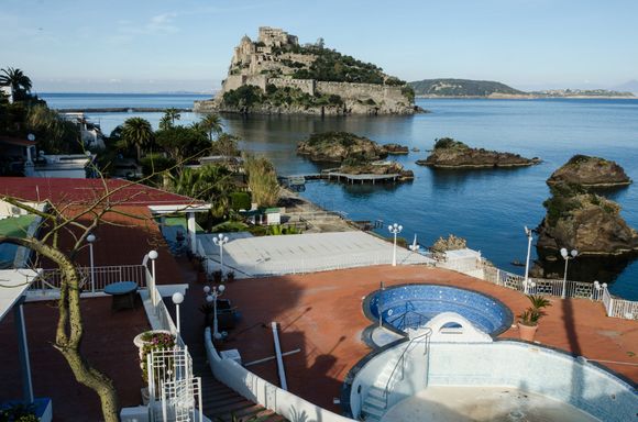 The Cartoromana belvedere overlooks the sprawling 'Termale Eden' spa. That popular thermal spa was in the process of preparing for opening in the next few weeks. Those islets trace the edges of Ischia's own submerged ruin, the 'Villa Romana'. Snorkelers love to explore those ruins. As we traipsed across that SE corner of the isle, we joined another hiker. She was lovely young Veronique, a Belgian archaeologist who worked in Holland. She was also very knowledgeable about Euro-travel in general.