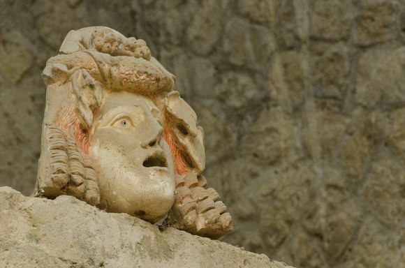 Roman theatre mask decor replica. Some of the best relics are in the Naples Archaeology Museum, an absolute must-visit. It seems that 18C Bourbon diggers made off with a lot of items. 