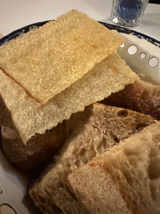 Astoundingly great, crispy pane carasau. at top of photo