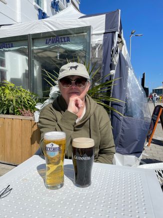 Moi. I never wear a cap. Every pic he took of me had my hair standing up in the wind. So I put on his, which he had lost an hour before. It blew right off his head and he didn’t even realize it. We had to go back and find it. It may or may not have been run over.