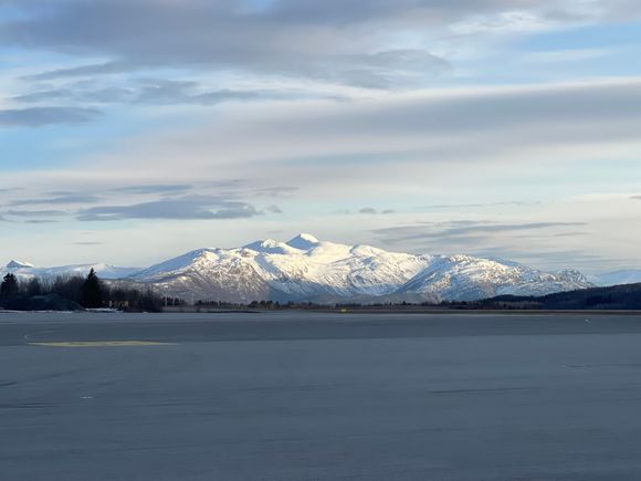 Runway with the view of a snow capped mountain 