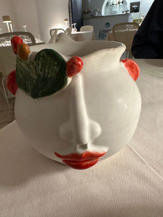 Carafes for house wine are crafted by a Palermitana who lives and works on the isolated Aeolian Island of Fillicidi for half the year.  No cars on that island!