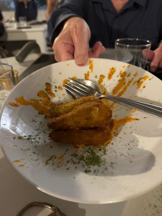 Fiore di zucchini, stuffed with the traditional ricotta and anchovy, and smoked Datterino tomatoes, then lightly fried.  Notice the mention of the type or login of the tomatoes served in many Sicilian restaurants.   My dinner companion has already ordered seeds to plant in her garden outside Oakland!