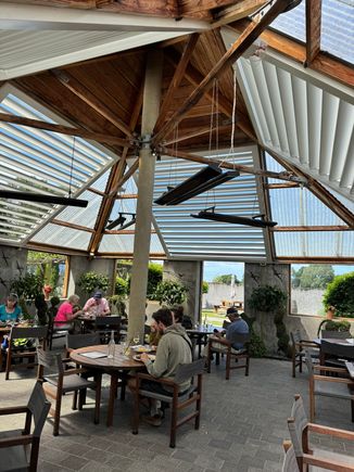 We dined in this light-filled covered patio dining area because it was breezy. There are large open windows, so you feel like you are outdoors.