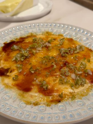 I'd never had an ensaladilla (typical Spanish cvcild salad that includes potatoes and other things) with a bruleed crust before; the toque of Chef Quique Dacosta,  who has earned 3 Michelin starts tag his Denia flagship) and under whose helm the restaurant operates