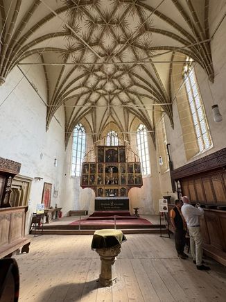 Classic late Gothic hall church with intricate stone-ribbed vaulting