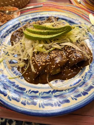 A breakfast of enchiladas with mole poblano hits the spot! 