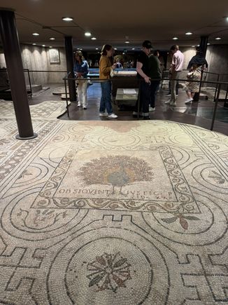 There are large fragments of mosaic flooring