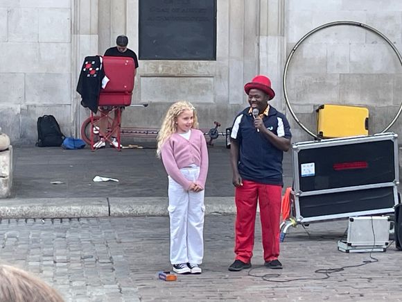 Classic street performer.  Bring in a cute young girl to help out his routine and generate more tips!