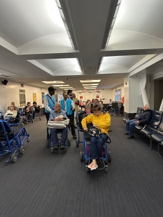 Non ambulatory passengers waiting for a "push" to immigration and baggage claim.