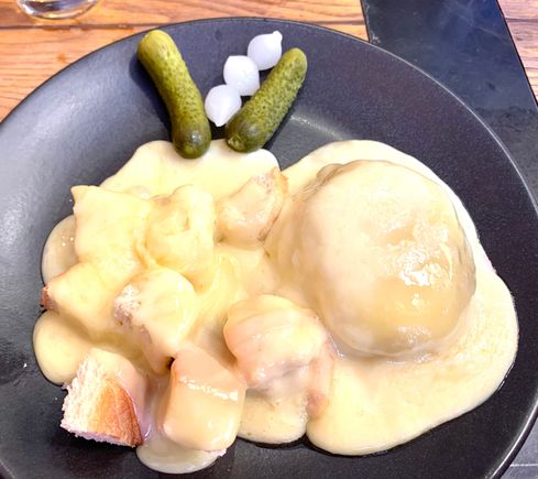 Cheese over mashed potatoes and bread cubes 