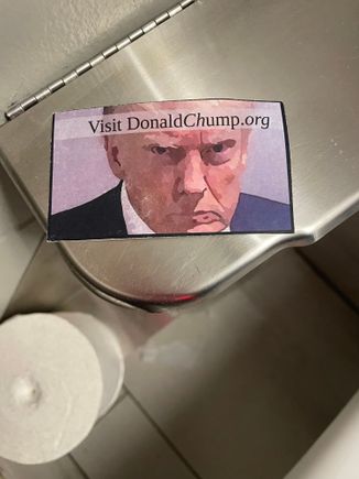 This was in a stall in the ladies bathroom. Scary!! Haha. I’m not promoting any website, I haven’t even looked at that. It was the picture watching me and the thought that someone left it there. 