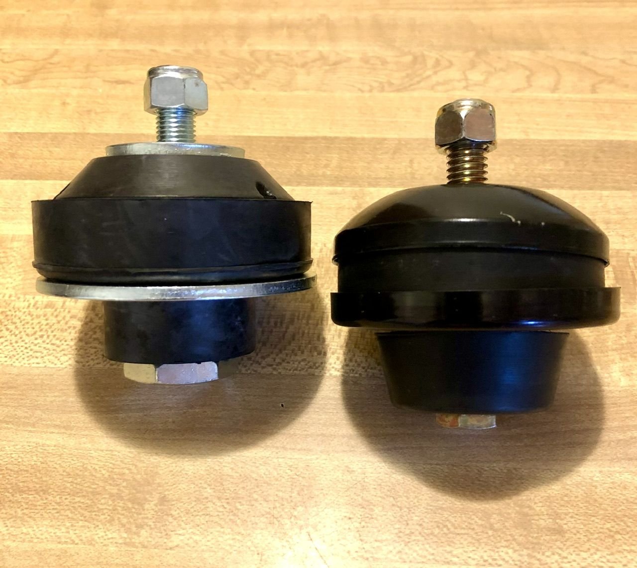 On the left is the Speedway Motors mount, on the right is the mount that came in the Trans-Dapt kit. The Speedway mount is made of a harder, more dense rubber and is better that the soft mounts that come in the kit.
