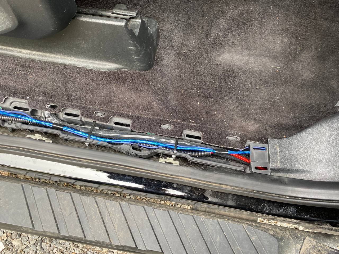 The wires tuck very nicely under the door trim.