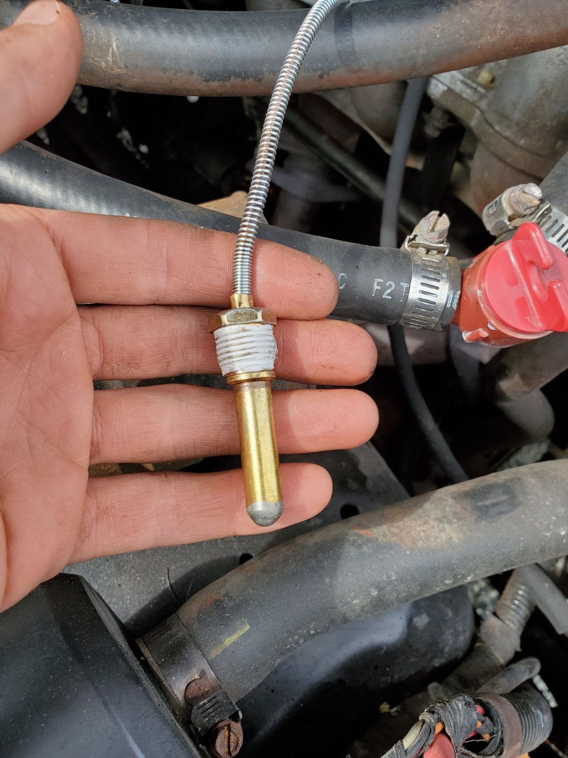 Installing aftermarket temp gauge but sending unit too long. Ford