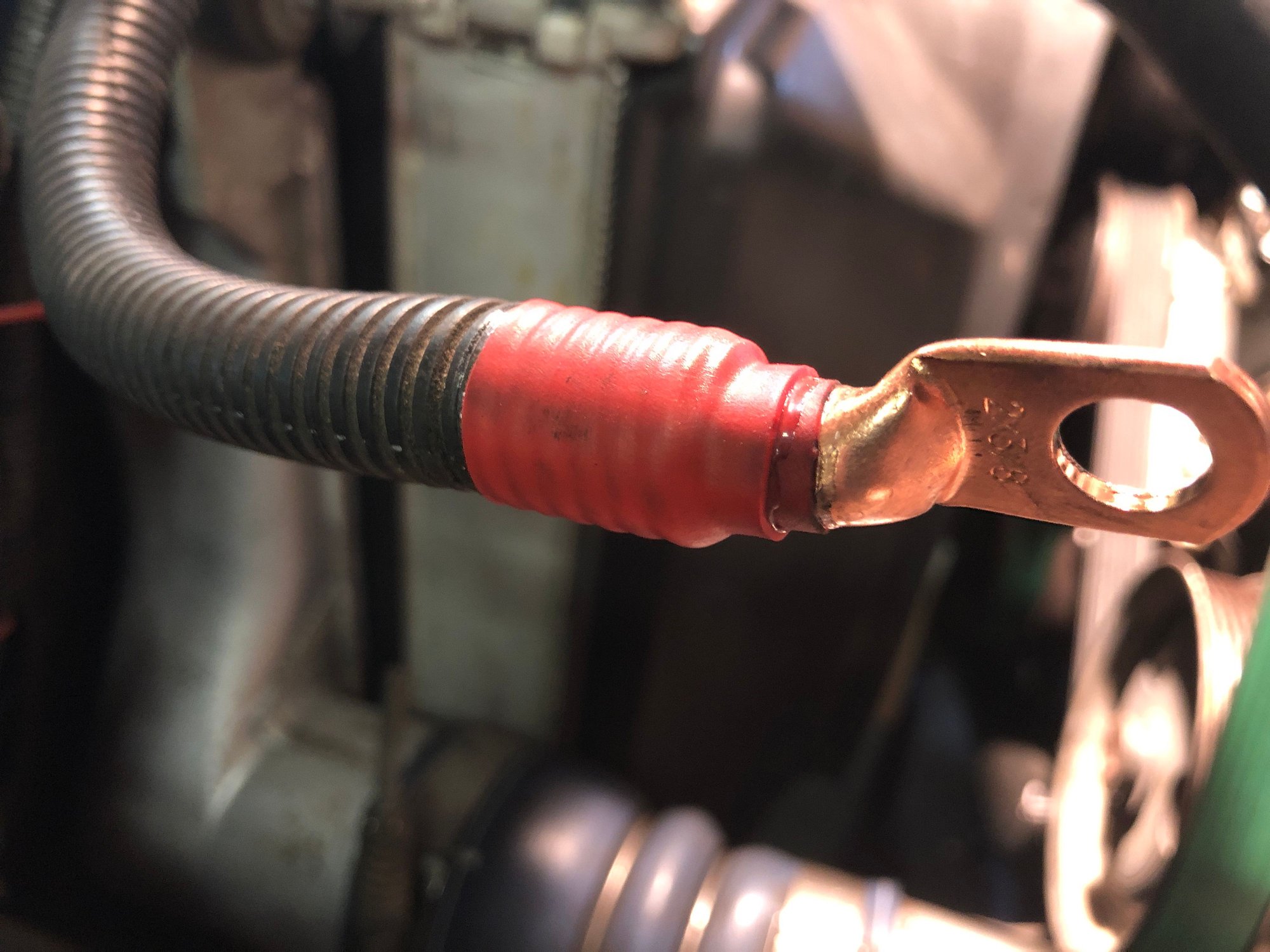 I used adhesive lined shrink from cable to lug, then also locked in the split loom. 