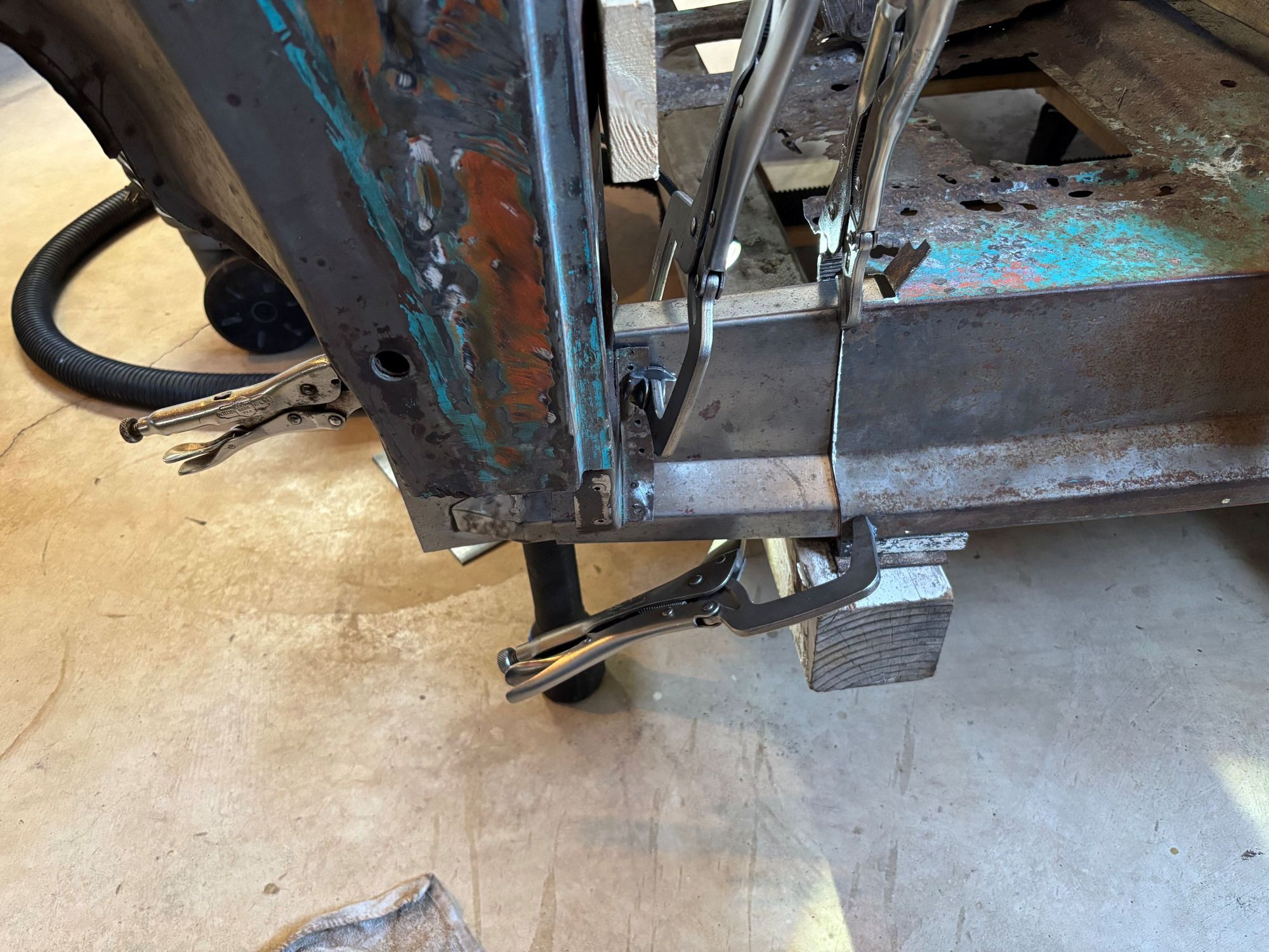 First piece of rocker panel clamped in place for welding.