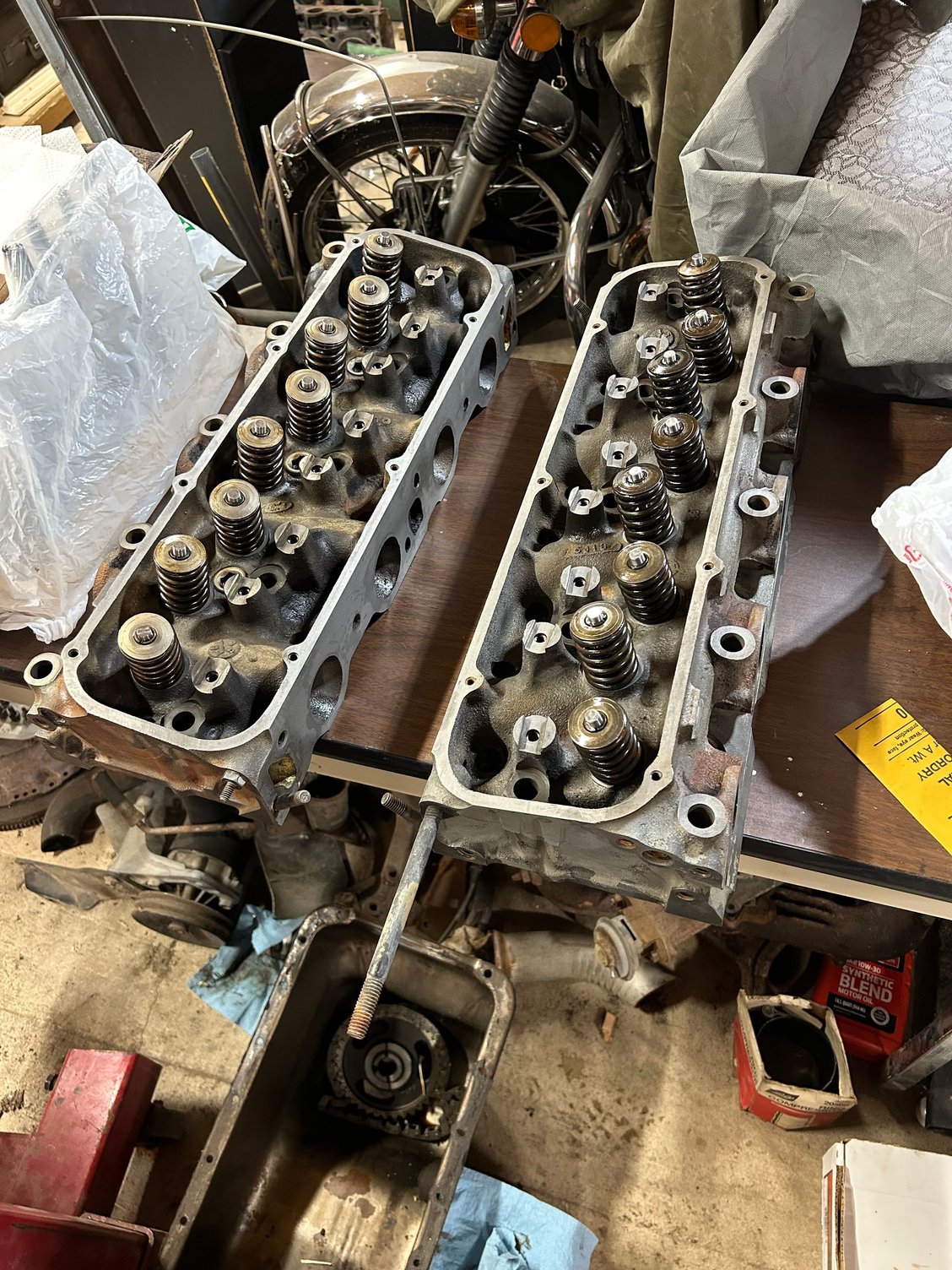 Then dried it off again by setting them on the woodstove getting them hot and evaporating all the water that was left on them and then the screw holes. Then after I got the second one assembled, I decided to scrub a little bit on the valve covers and then set them on top just to keep the dust off of them