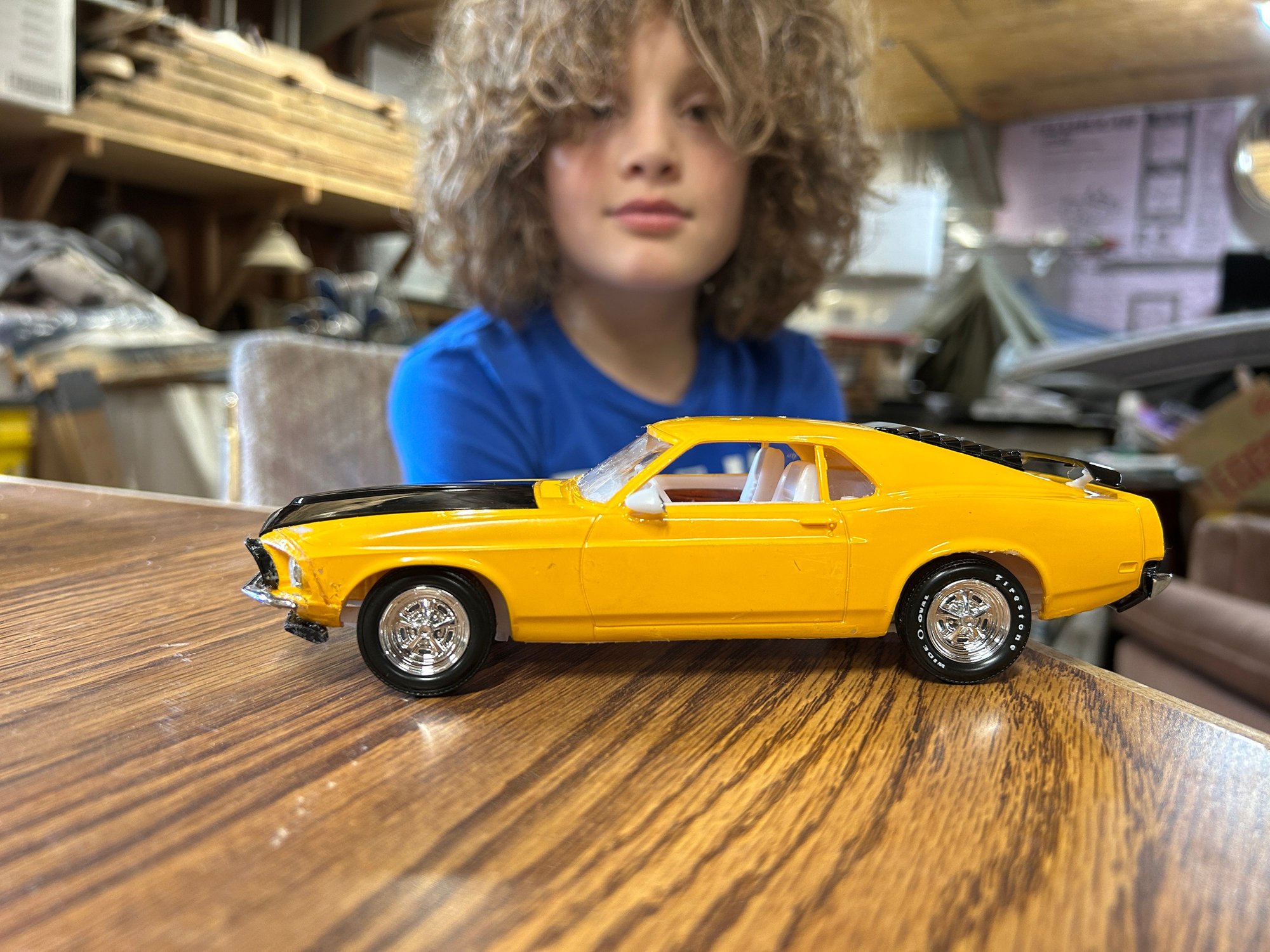Just as I was working to get the fuel bowls off my middle boy got done with his model car so I had to get a picture of him with it so that we could show it off. Pretty good for the first model he�s ever done by himself. I was really impressed. He went through the instructions and did everything by himself. I only had to help with a couple of things to show him how they go together pretty impressed with this young dude.