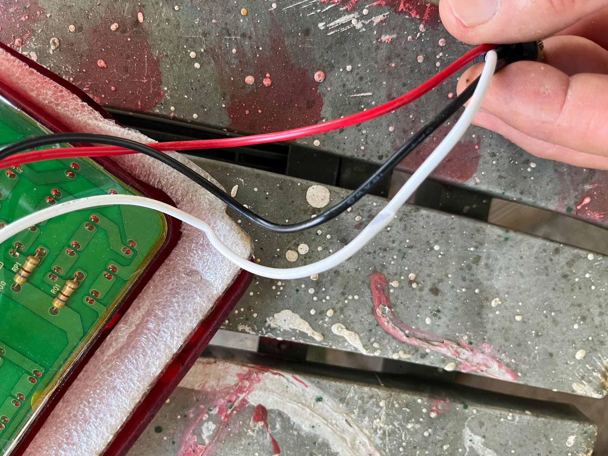 I found the white wire had been crimped in 2 places, it got caught between the housing and the lens!