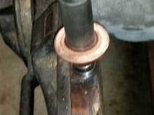 Copper washer on plunger.